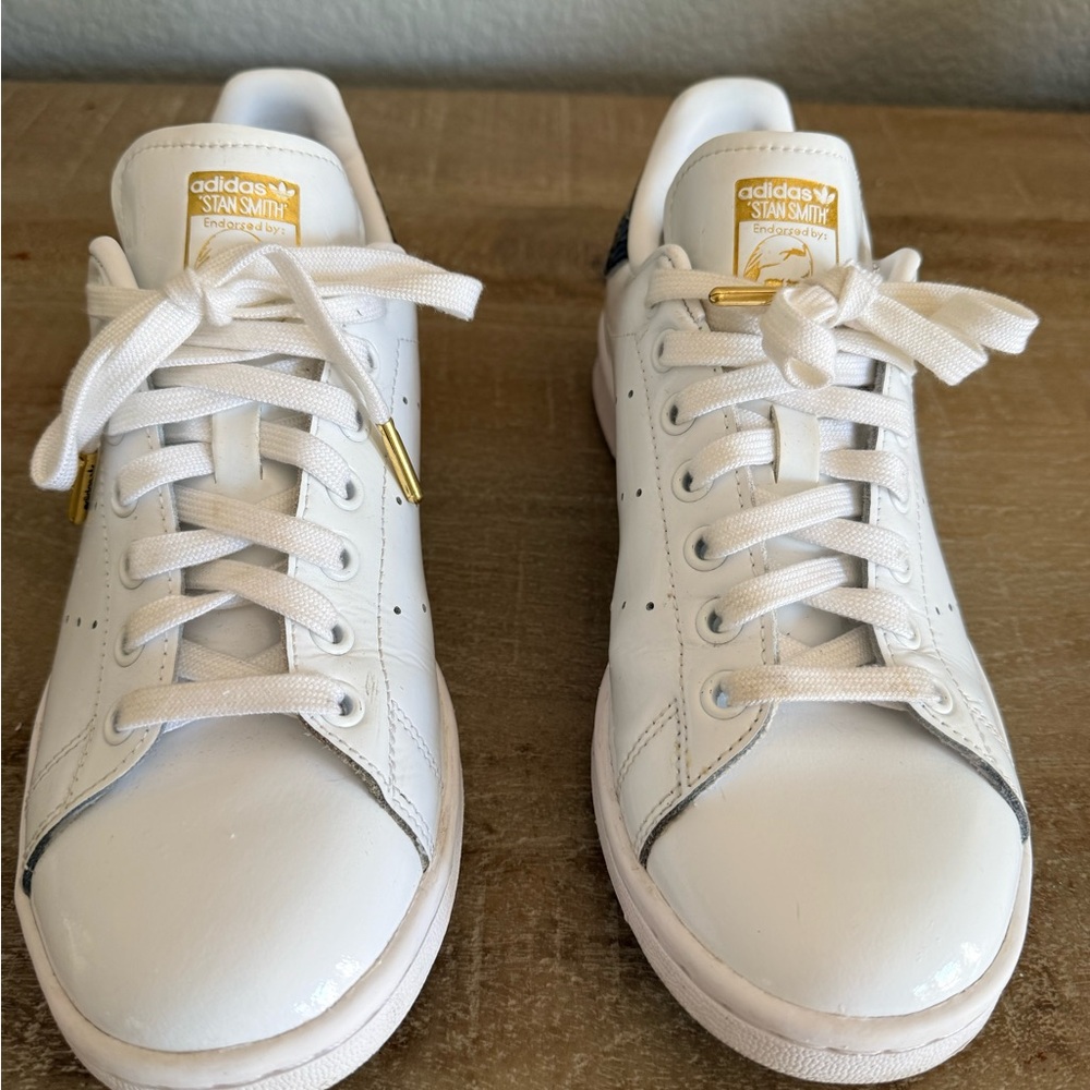 Adidas Stan Smith patent leather sneaker.